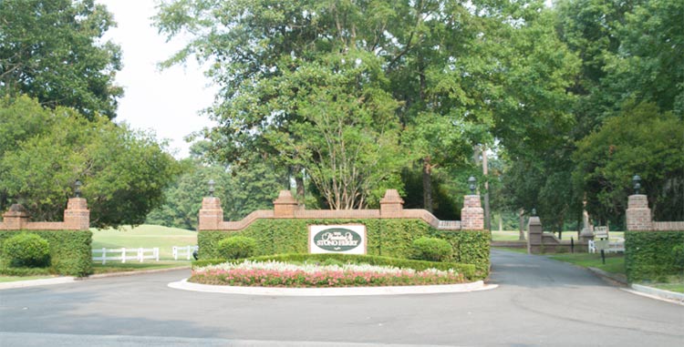 an entrance sign to The Plantation at Stono Ferry in Hollywood, South Carolina